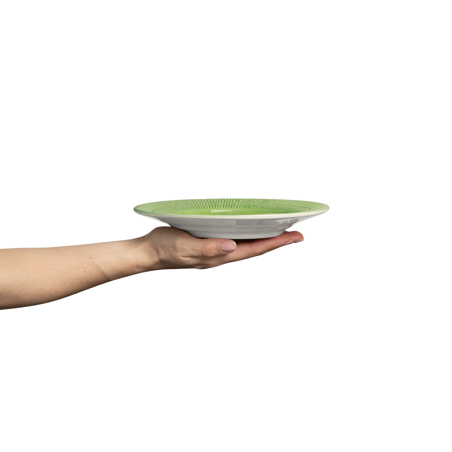 Hand holding a green plate on a white background