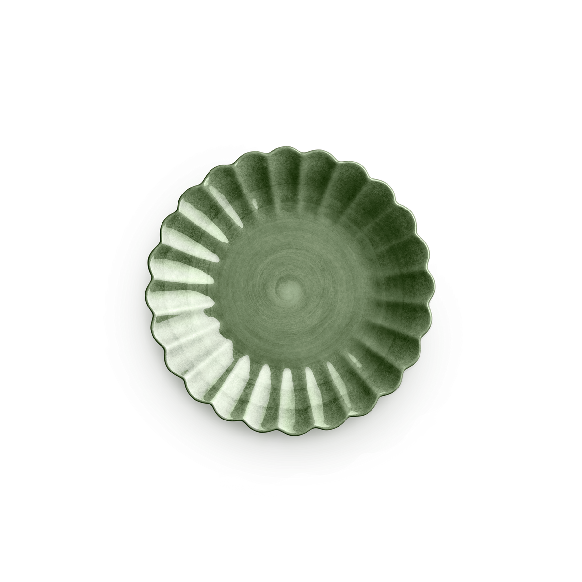 Green ceramic dish with a fluted edge on a white background