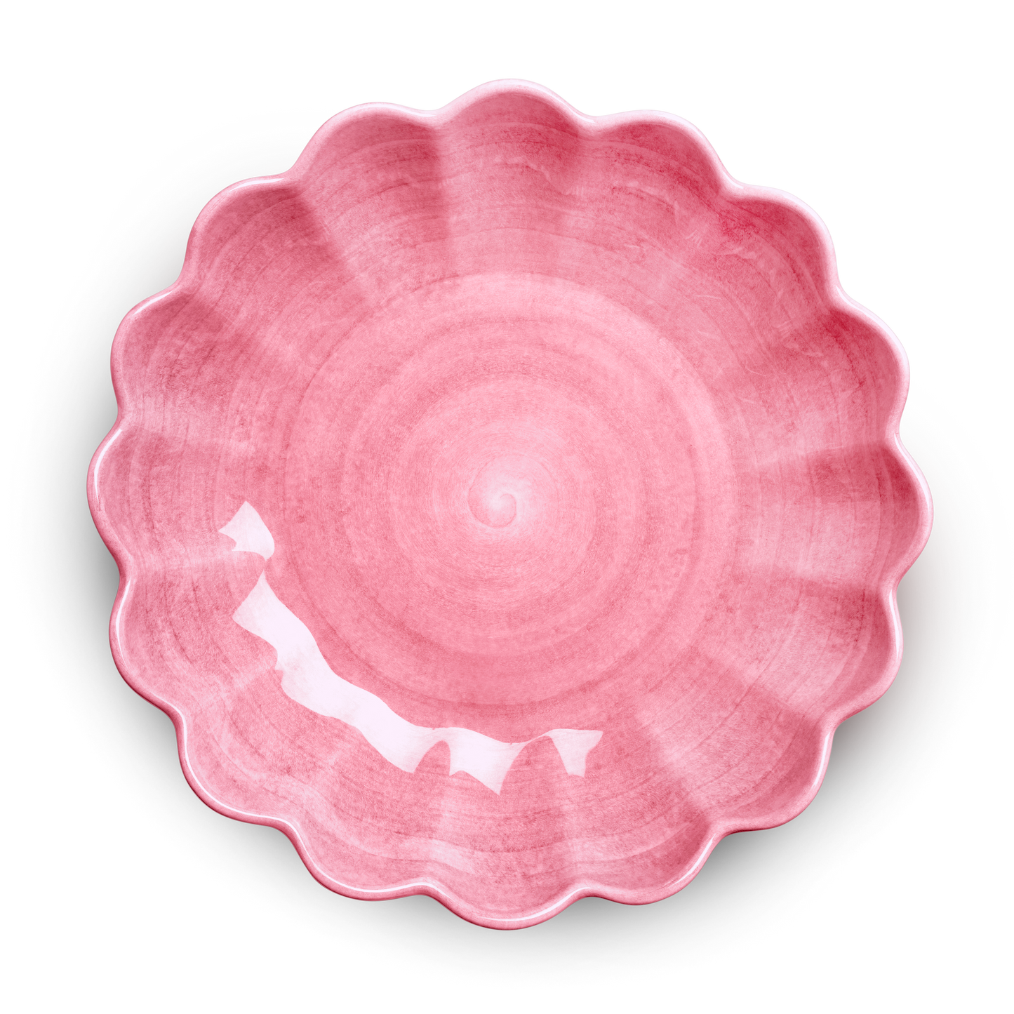 Pink ceramic bowl with scalloped edge on a white background