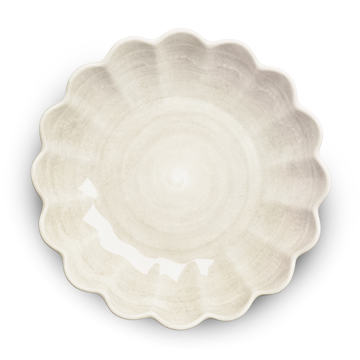 White ceramic pie dish with scalloped edge on a white background