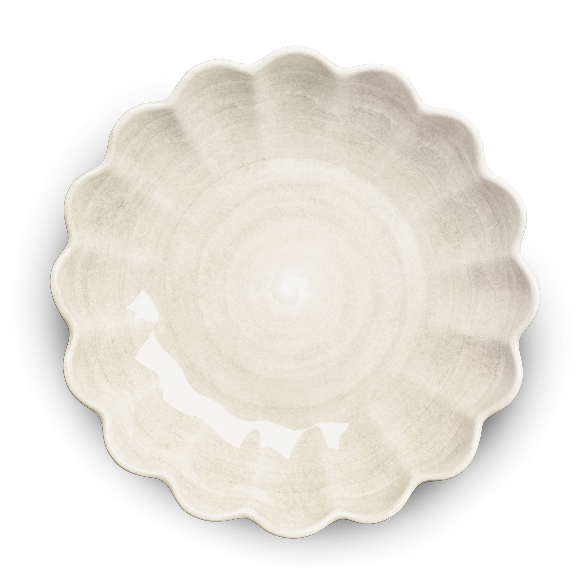 White ceramic pie dish with scalloped edge on a white background