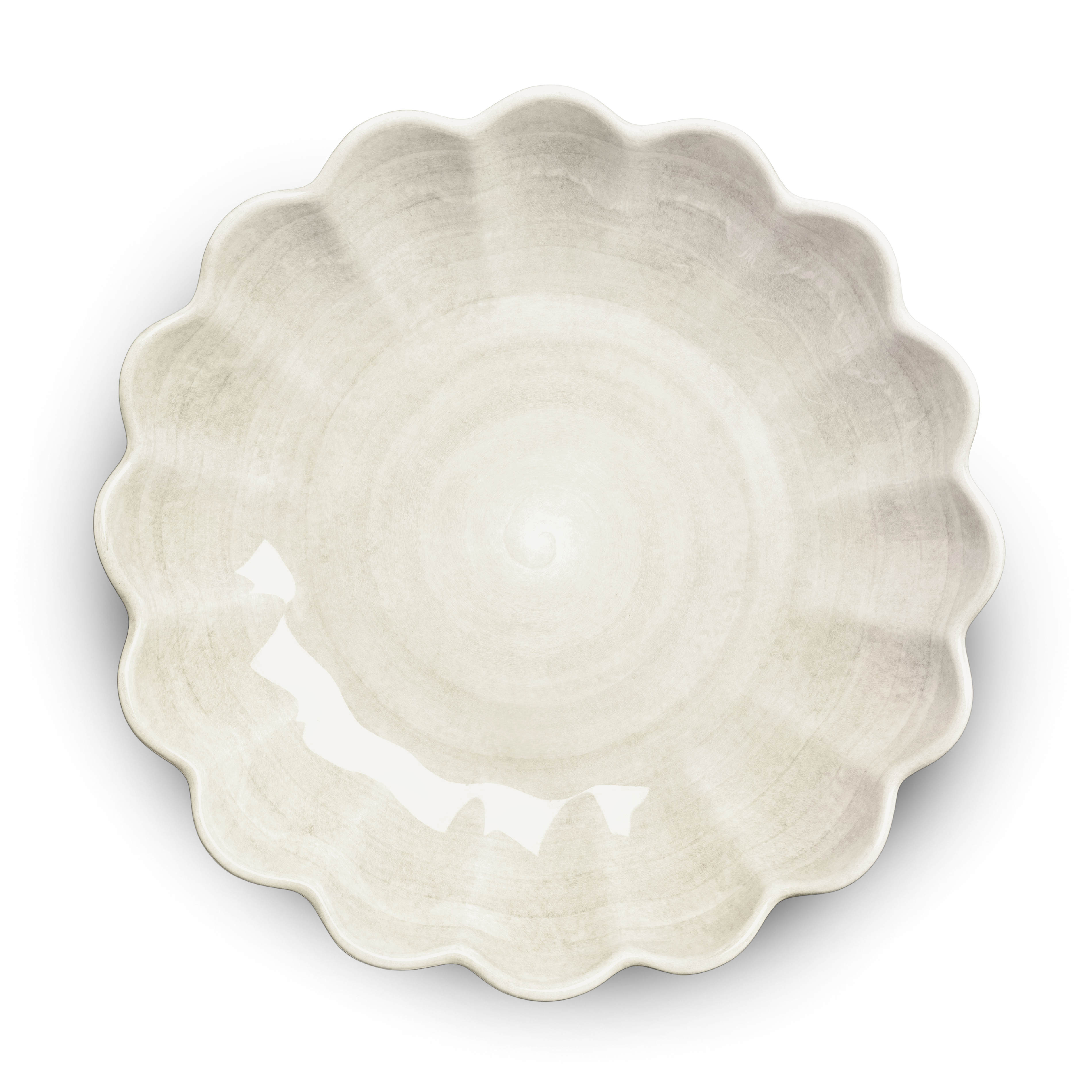 White ceramic pie dish with scalloped edge on a white background