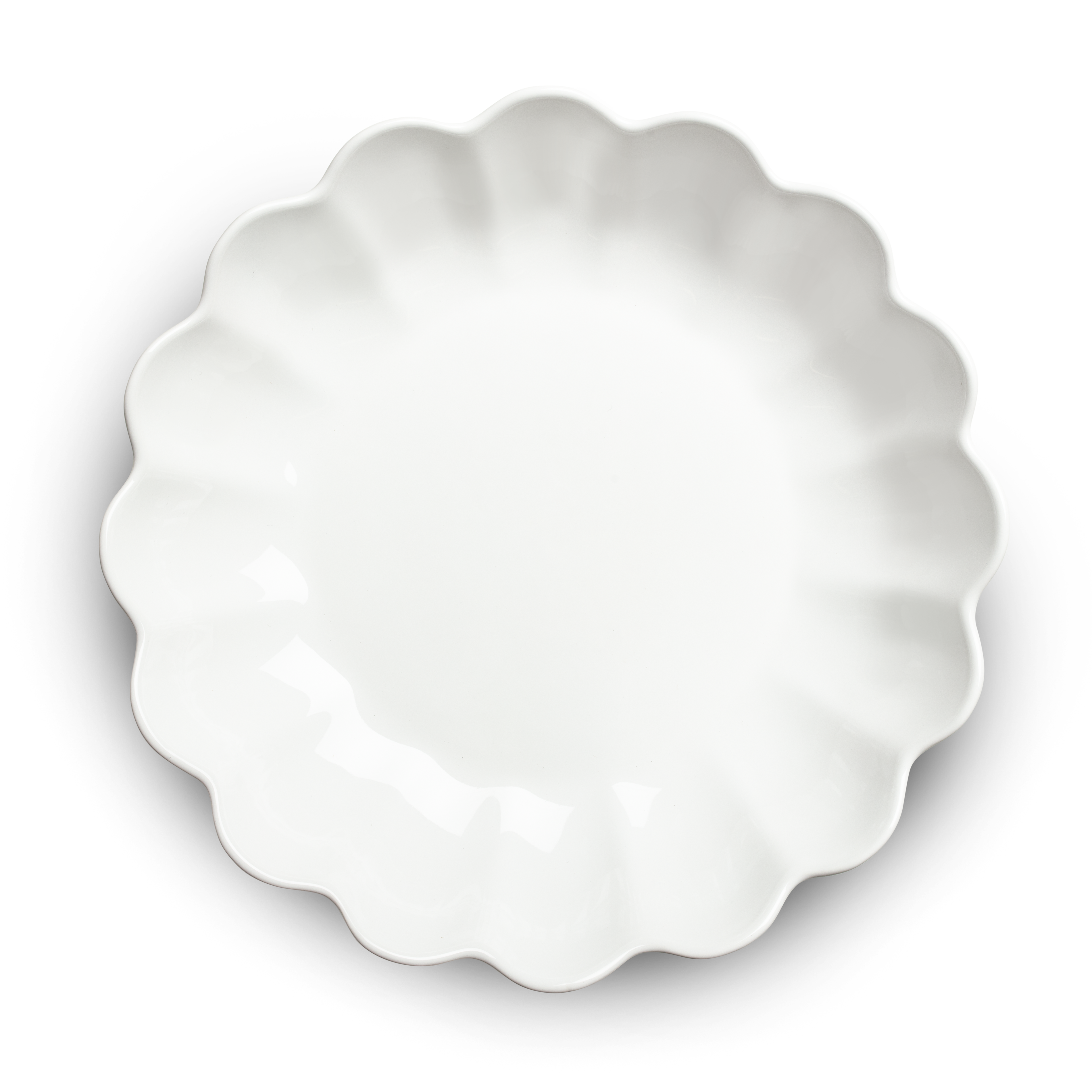 White ceramic pie dish with scalloped edge on a white background