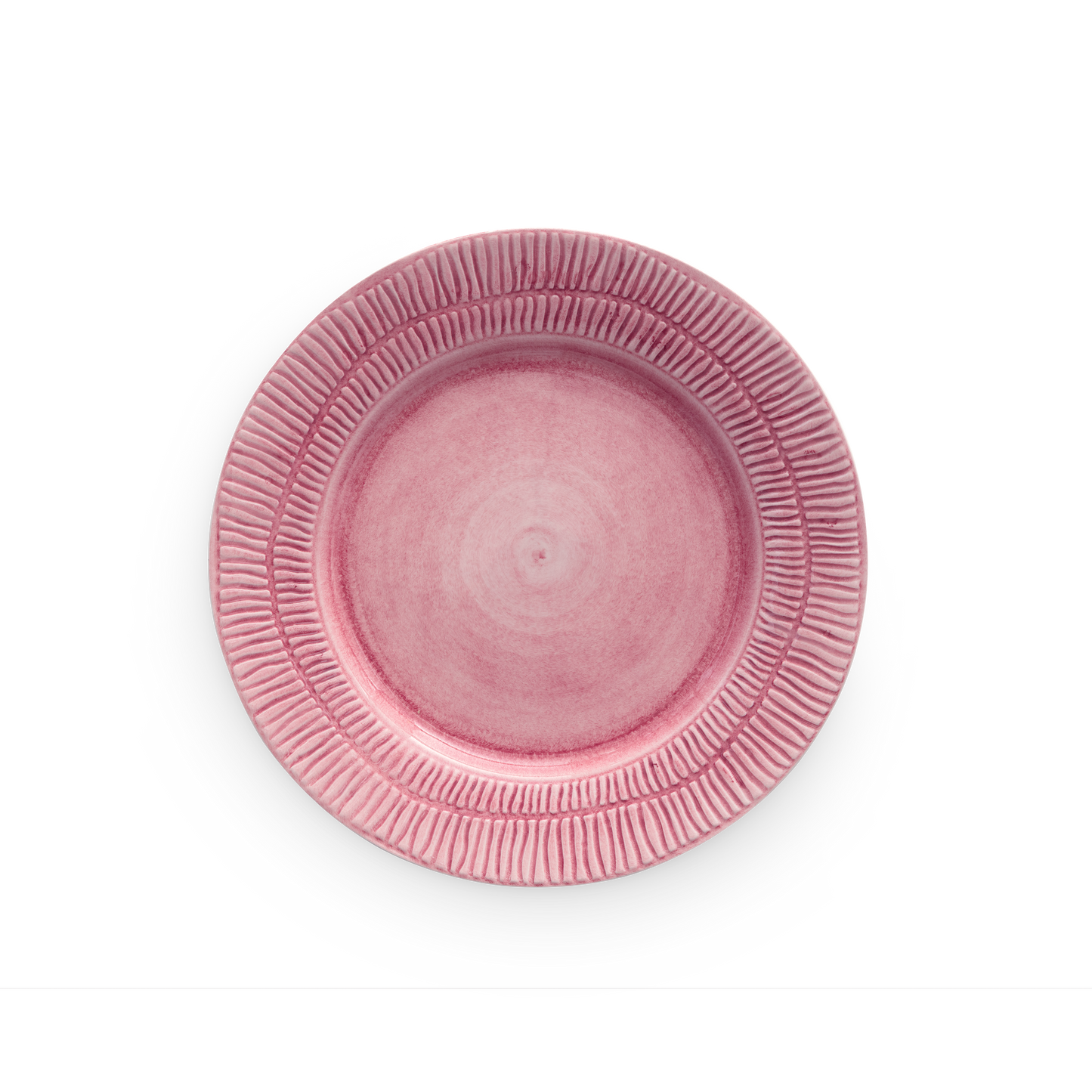 Pink ceramic plate with textured rim on a white background