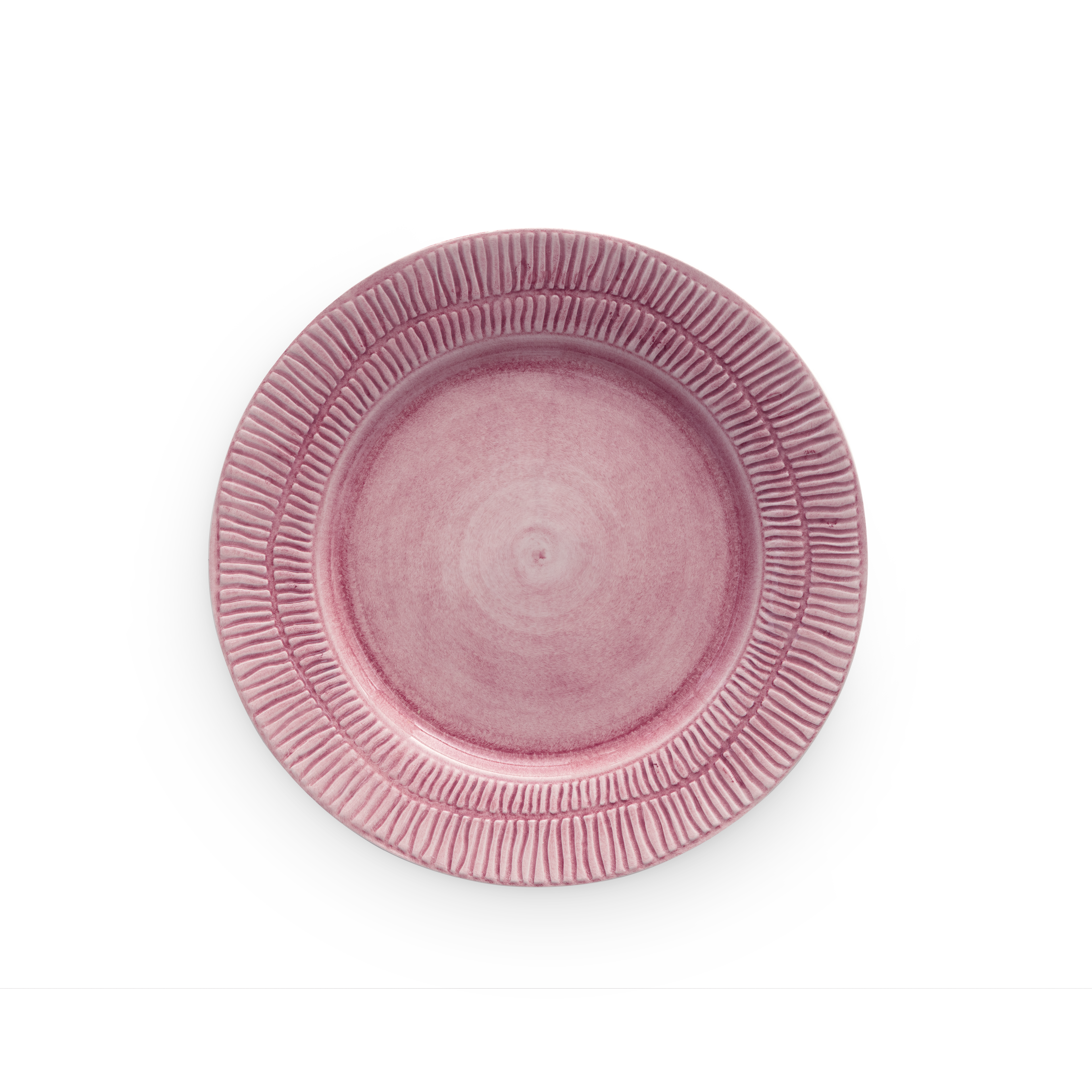 Pink ceramic plate with textured rim on a white background